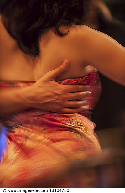 A closeup of a young man and woman dancing Milonga Tango in Argentina.