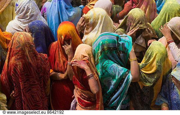 A colourful crowd of people celebrate the Holi Festival  Mathura  Uttar Pradesh  India