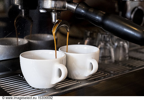 A commercial expresso machine in a coffee shop.