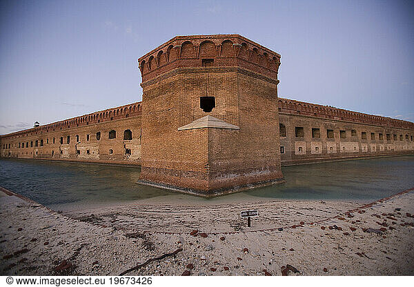 A corner view of the Fort Jefferson Fortress showing the cannon window and moat.