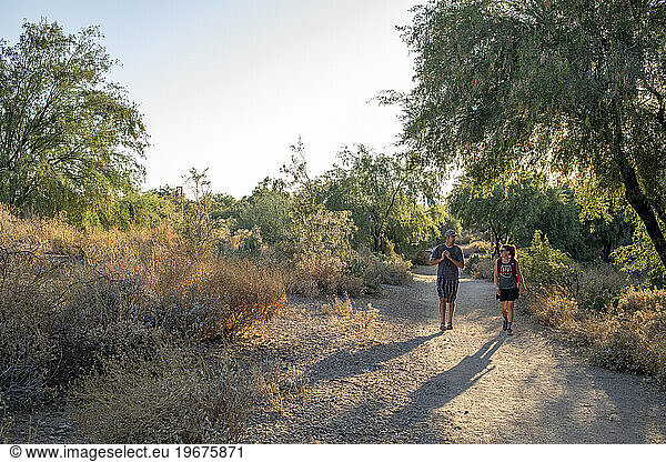 A couple hiking desert nature trail