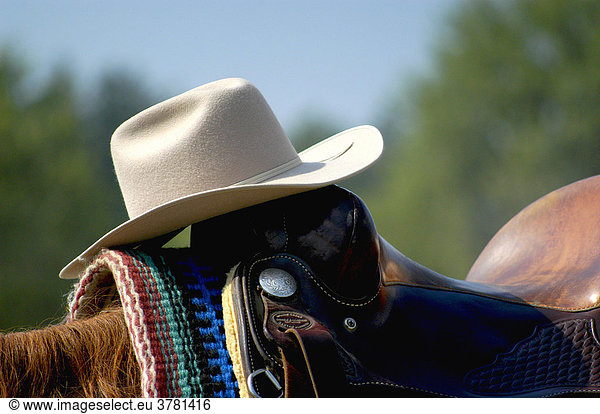A Cowboy Hat on a Western Saddle
