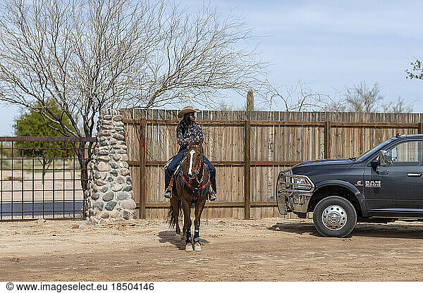 A cowgirl on horseback at the Arizona Black Rodeo