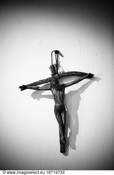 A cross hanging on the wall in the Santa Barbara Mission  Santa Barbara  California.