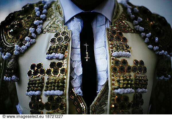 A cross representing good luck sewn into the tie of a matador  Plaza Monumental  Tijuana  Mexico.