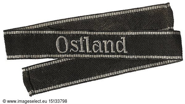 A cuff title 'Ostland' Issue for officers  hand-embroidered metal thread. Length 46 cm. historic  historical  20th century  1930s  1940s  Waffen-SS  armed division of the SS  armed service  armed services  NS  National Socialism  Nazism  Third Reich  German Reich  Germany  military  militaria  utensil  piece of equipment  utensils  object  objects  stills  clipping  clippings  cut out  cut-out  cut-outs  fascism  fascistic  National Socialist  Nazi  Nazi period