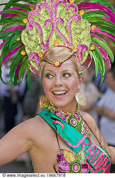 A dancer takes part in the parade of the Copenhagen Whitsun Carnival  Denmark.