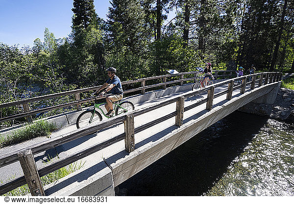A family enjoys a bike ride on a bike path in South Lake Tahoe  CA