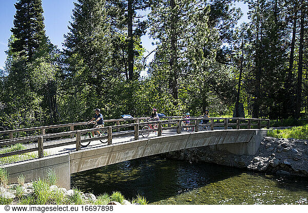 A family enjoys a bike ride on a bike path in South Lake Tahoe  CA