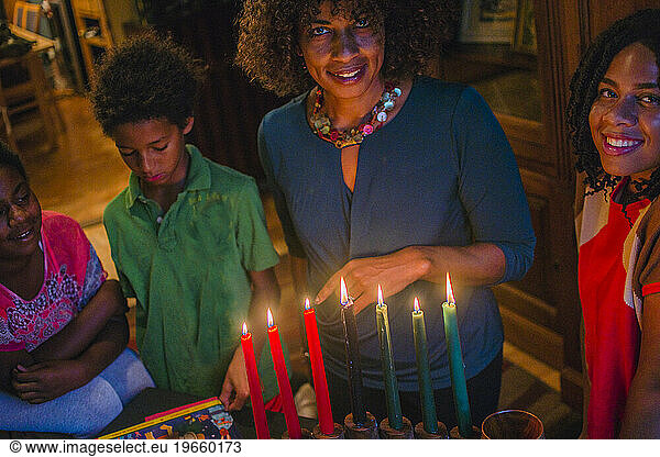 A family gathers around the Kwanza candles