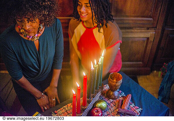 A family gathers around the Kwanza candles