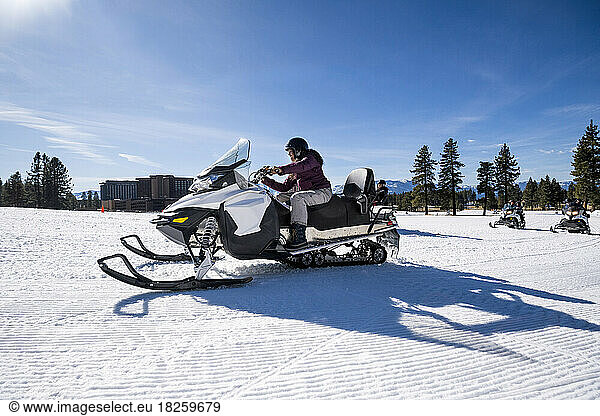 A family snowmobiling in Stateline  Nevada.
