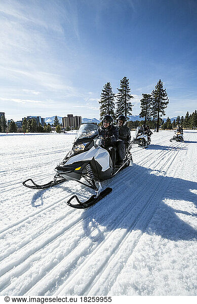 A family snowmobiling in Stateline  Nevada.