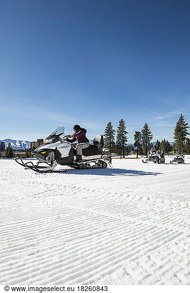 A family snowmobiling in Stateline  Nevada.