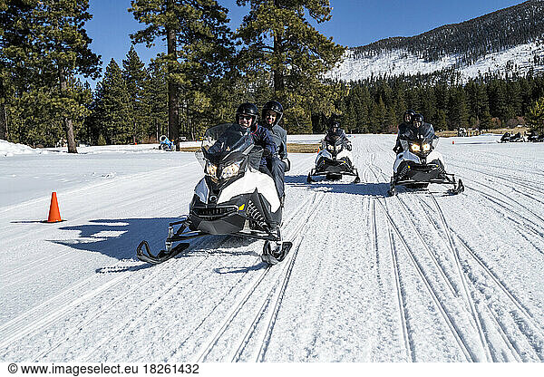 A family snowmobiling in Stateline  Nevada.
