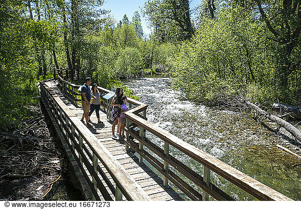 A family walks on a nature trail in South Lake Tahoe  CA