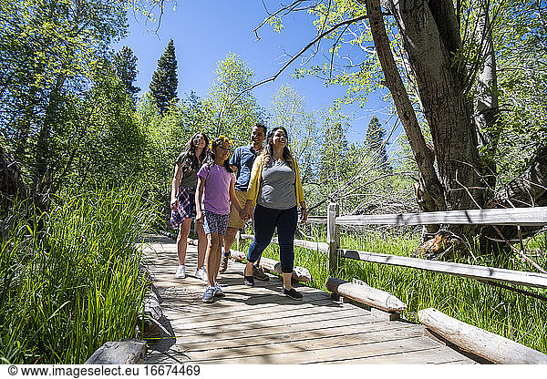 A family walks on a nature trail in South Lake Tahoe  CA