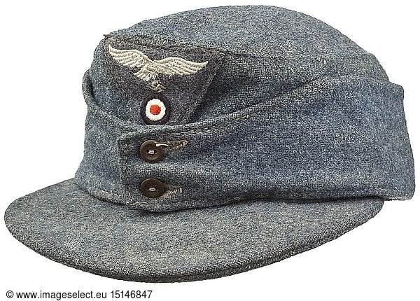 A field cap M 43 for enlisted men/NCOs of the Luftwaffe Depot piece in rough woollen cloth  brown Bakelite buttons  machine embroidered cap trapezoid  steel-blue inner liner (herringbone) with illegible maker stamping from the year 1944. historic  historical  Air Force  branch of service  branches of service  armed service  armed services  military  militaria  air forces  object  objects  stills  clipping  clippings  cut out  cut-out  cut-outs  20th century