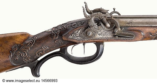 A fine percussion rifle/shotgun combination  Kummer in Suhl  circa 1830/40. Damascus barrels  the rifle barrel has eight-groove rifling in 14.5 mm calibre  the shotgun barrel is in 15 mm calibre. Mid rib with a silver-inlaid signature  'E.F. Kummer in Suhl'. Dovetailed sights. The roots of the barrels and the tang are finely engraved. Lavishly engraved and chiselled locks with gold-inlaid background in places. Lock plates terminate in boar heads. The cocks are shaped as dragons. Finely engraved nipple protectors provided with rollers. Double set trigger. Dark horn trigger guard. Walnut half stock is richly carved with vine decoration. Cheek piece displays a hunting scene carved in relief. Patch box. Engraved nickel-silver furniture. Iron ramrod with horn tip. Length 113 cm. Erwerbsscheinpflichtig. historic  historical  19th century  civil long guns  gun  weapons  arms  weapon  arm  firearm  fire arm  gun  fire arms  firearms  guns  object  objects  stills  clipping  clippings  cut out  cut-out  cut-outs