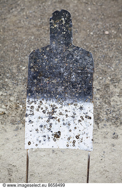 A firing practice target in the shape of a person  on a desert firing range in Nevada.