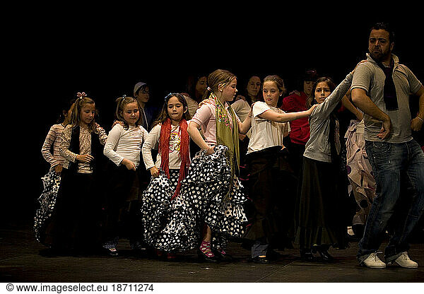 A Flamenco dancer  or bailaor  teaches a young girl to dance in Prado del Rey  Cadiz province  Andalusia  Spain.