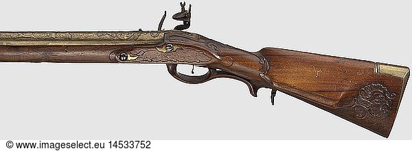 A flintlock shotgun  German  circa 1780. Round (earlier) barrel with smooth bore in 16 mm calibre with a brass bead. At the rear of the barrel fitted with a brass sleeve with relief and engraved decoration showing a and hunting scenes amid scrolling foliage. Cut flintlock with a bevelled brass lockplate. Walnut half stock with rocaille carving and a wooden trigger guard. Horn nose cap and brass furniture. Replacement ramrod with brass tip. The iron pieces patinated and somewhat pitted. Length 149 cm  historic  historical  18th century  civil long guns  gun  weapons  arms  weapon  arm  firearm  fire arm  gun  fire arms  firearms  guns  object  objects  stills  clipping  clippings  cut out  cut-out  cut-outs