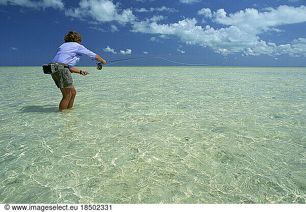 A fly-fisherman casts to his quarryin the Bahamas.