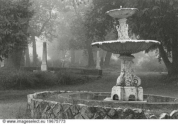 A foggy cemetery with a dry fountain  California.