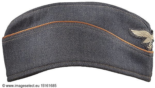 A garrison cap for Luftwaffe female auxiliaries depot piece from the year 1942 Luftwaffe-grey gabardine  continuous copper-brown cord  machine embroidered Luftwaffe eagle  grey-blue silk liner with faded depot-  size and maker stampings. historic  historical  Air Force  branch of service  branches of service  armed service  armed services  military  militaria  air forces  object  objects  stills  clipping  clippings  cut out  cut-out  cut-outs  20th century