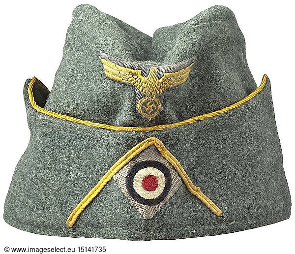 A garrison cap M 38 'Schiffchen' for officers of the coastal artillery depot piece upgraded upon owner's promotion Field-grey woollen cloth  green painted zinc ventilation rivets  continuous golden-yellow braid (stitched on at the time)  the inner liner with acceptance- ('B.A.K. 31.7.39')  maker-  year cipher ('1939') and size stamping ('55'). BeVo weave insignia (golden-yellow on a field-grey ground)  golden-yellow soutache chevron. historic  historical  navy  naval forces  military  militaria  branch of service  branches of service  armed forces  armed service  object  objects  stills  clipping  clippings  cut out  cut-out  cut-outs  20th century