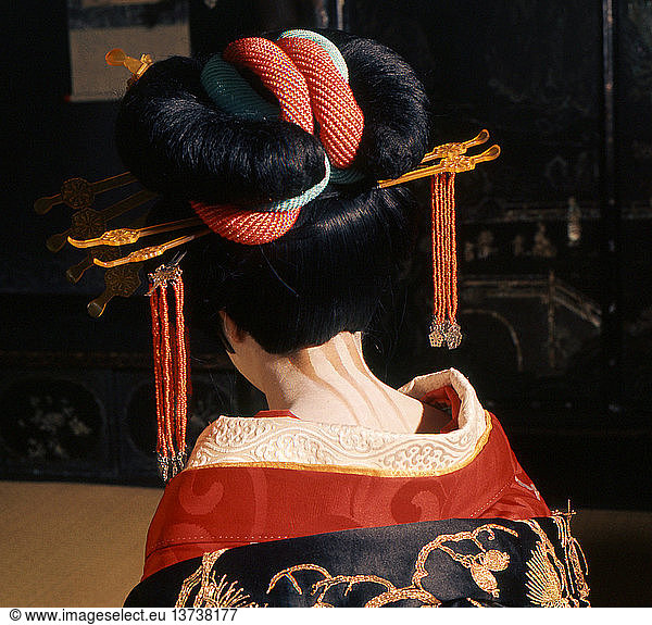 A geisha in traditional dress and make-up  The neck of the female was regarded as a highly erogenous zone. Here it is emphasised by dramatic make-up.Japan. Kyoto.