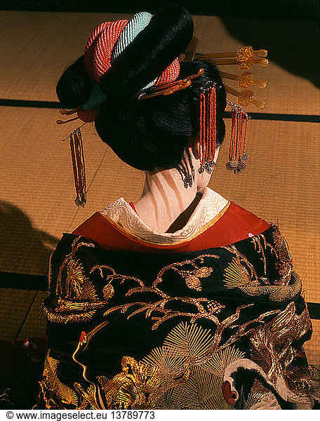 A geisha in traditional dress and make-up  The neck of the female was regarded as a highly erogenous zone. Here it is emphasised by dramatic make-up. Japan. Japanese. Kyoto.