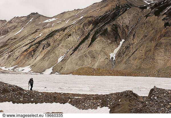 A geologist hikes down a moraine  Jarvis Glacier  Tatshenshini-Alsek Provincial Park  British Columbia  Canada.