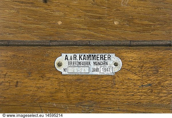 A German army telephone switchboard.  Ten lines complete with their pins and box  made by A&R Kammerer in Munich  including the removable case for calls and the rare extension cable ending in a wooden plate. We add two desk telephones in black bakelite complete with receiver  cables and crank  a headset and a telephone receiver with their pin  three field telephones with bakelite boxes  receivers and cranks. historic  historical  1930s  1930s  20th century  technical  technic  material  materials  device  devices  equipment  equipments  utensil  piece of equipment  utensils  technology  militaria  military  object  objects  stills