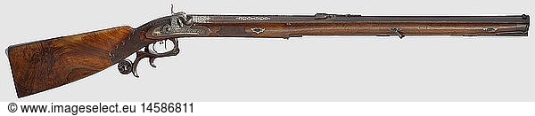 A German percussion rifle  Michael Johann Baader in Neumarkt  circa 1850. Octagonal barrel in 13 mm calibre  finely engraved sights as well as rich silver inlays on top  gold-inlaid signature. Patent breechblock  the tang engraved with tendrils and fitted with folding aperture rear sight. Cut and engraved percussion lock  also with gold inlays and signature. Adjustable double set trigger. Lavishly carved walnut full stock with en suite engraved iron ickel silver furniture. Wooden ramrod. The barrel slightly patinated  the stock with traces of use  wooden trigger guard with old repair of a crack. Length 112 cm. Cf. Heer  Der neue StÃ¶ckel  vol. 1  p. 43  historic  historical  19th century  civil long guns  gun  weapons  arms  weapon  arm  firearm  fire arm  gun  fire arms  firearms  guns  object  objects  stills  clipping  clippings  cut out  cut-out  cut-outs