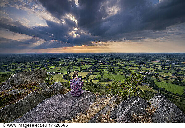 A girl looks out over the Cheshire Plain from Bosley Cloud  Cheshire  England  United Kingdom  Europe