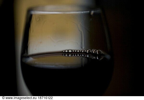 A glass of red wine sits in the Taramilla winery in Prado del Rey  Cadiz province  Andalusia  Spain.