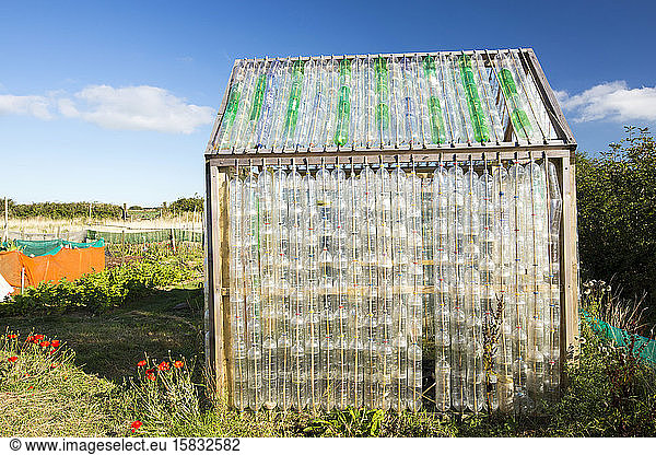 A greenhouse made from plastic bottles in the community garden