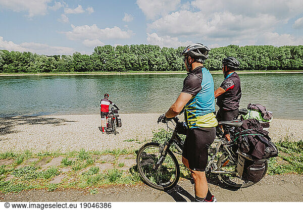 A Group of cyclists have fun in the Rin river  Germany