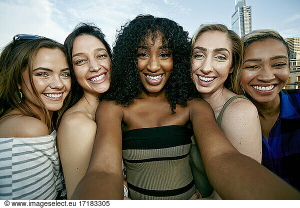 A group of five young women posing for a selfie