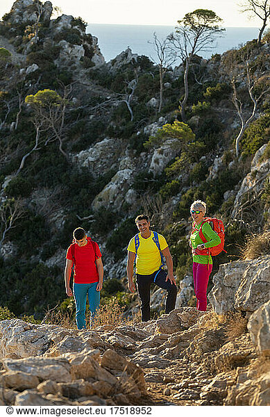 A group of friends hiking on the mountain  Calpe  Alicante  Spain
