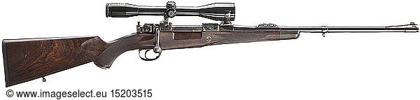 A Hagn repeating rifle  deluxe model with scope  Cal. 9.3 x 62  no. 6633. Bright bore  length 54 cm. German 1985 proof mark. Fixed sight. Front sight with brass inlay. Two folding rear sights. Barrel finished black. Tangent sight blocks engraved. Front sight base with inlaid gold thread. Action of different Mauser models. Wing safety at the side. Direct trigger. Movable diopter on firing pin nut. Hinged magazine plate. Case-hardened action and lock. Fine vine engraving on action  firing pin nut and bolt handle. Also on magazine plate and trigger guard. Inlaid gold threads. Finely-grained walnut root wood stock with checkering and cheek. Green horn frontal shaft end. Rubber butt cap. Little metal pistol grip cap with engraving and gold threads. Small inner compartment  lid with engraved monogramme. Swivel mounts. Schmidt & Bender scope 6 x 42  reticule 4 on Suhl frog mount. Weapon carries few usage marks. Total length 108 cm. Erwerbsscheinpfl 20th century