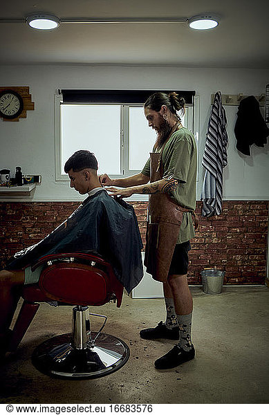 A hairdresser working in his own salon