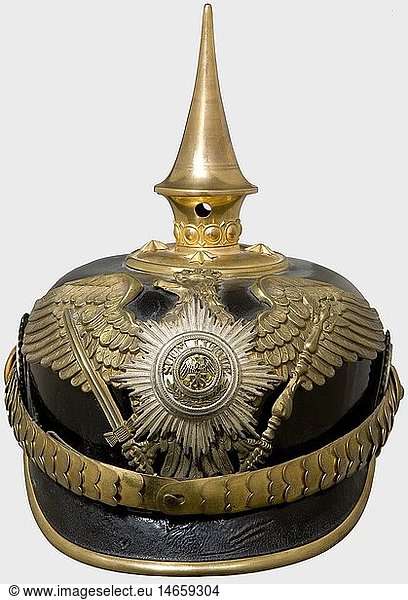 A helmet for an officer  of the Prussian Guard Train Battalion Black lacquered leather skull (age cracks) with gilt mountings  cambered metal chinscales  and guards eagle (worn by cleaning  pin resoldered) with a superimposed  silver-plated  enamelled star. Officer's cockades. The ribbed silk lining replaced. historic  historical  19th century  Prussian  Prussia  German  Germany  militaria  military  object  objects  stills  clipping  clippings  cut out  cut-out  cut-outs  helmet  helmets  headpiece  headpieces  utensil  piece of equipment  utensils  protection  headgear  headgears  uniform  uniforms