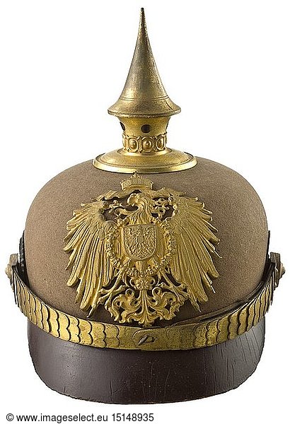 A helmet for officers of the East Asian Occupation Brigade Made circa 1915  brown felt with gilt (stained) brass mounts  visors and side reinforcements of brown lacquered leather  black leather lining (losses)  remains of old inventory label (tr.) 'plate 38 ... helmet for...officers in China...'. After various experiences made with tropical helmets  this is a development where the detachable spike is no longer mounted with star screws (pre-cut holes)  but screwed directly into the ventilation insert. Screw-mounted national eagle of the tropical helmet. Flat chinscales with fixed rosettes on button 91. Officer's cockades. Unworn  with signs of age. Extremely rare  probably a sample piece. historic  historical  navy  naval forces  military  militaria  branch of service  branches of service  armed forces  armed service  object  objects  stills  clipping  clippings  cut out  cut-out  cut-outs  20th century