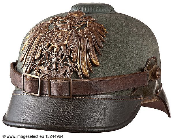 A helmet M 1900 for enlisted men of the East Asia Expeditionary Corps  depot piece  circa 1900 Leather skull with green felt cover  the visors and lateral reinforcements made of green leather. On the front imperial eagle plate in the version used for tropical helmets. Brown leather chinstrap with brass fittings on button 91  the imperial cockade on the right. Instead of the usual spike the helmet M 1900 has a screwed cap (green lacquered) on top. Black leather liner with loops  manufacturer's stamp 'H. Hoffmann  Berlin' (barely legible) inside the skull. Signs of age and usage. Extremely rare helmet in good  untouched original condition. An identical item can be seen in the reference book 'The German Colonial Troops' by Kraus/MÃ¼ller. historic  historical  navy  naval forces  military  militaria  branch of service  branches of service  armed forces  armed service  object  objects  stills  clipping  clippings  cut out  cut-out  cut-outs  20th century