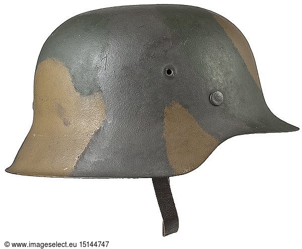 A helmet M 42 of the coastal artillery with camouflage paint The skull with the original field-grey rough camouflage lacquer of the Kriegsmarine  over which is a brown-green camouflage colouring  the inside with a stamping '1746' on the nape. Complete with liner and RB-number-stamped chin strap. Size 56. According to the consignor  the helmet derives from a bunker position of the coastal artillery in Denmark. historic  historical  navy  naval forces  military  militaria  branch of service  branches of service  armed forces  armed service  object  objects  stills  clipping  clippings  cut out  cut-out  cut-outs  20th century