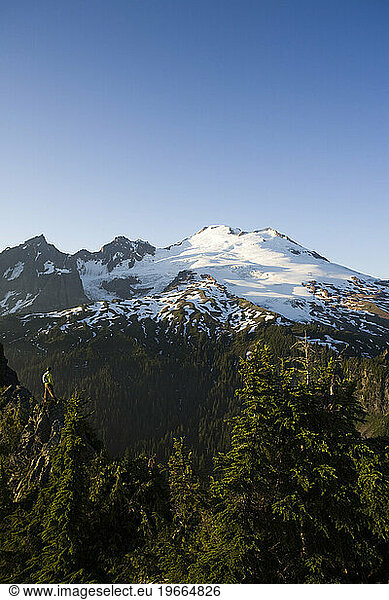 A hiker enjoys incredible views of Mt. Baker in western Washington.