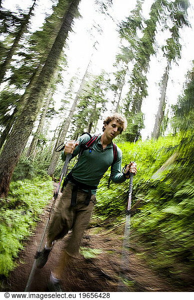 A hiker speeds up a trail in western Washington.
