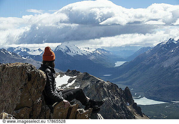 A hiker takes in the view after summiting Mt. Madsen.